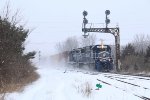 Z127 makes quick time southward in to the snowstorm as it passes under the signals at north end Grand Blanc